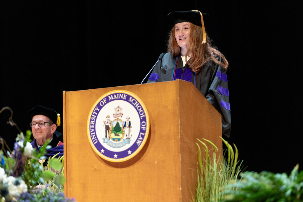 Photo of student graduation speaker Mackenzie Blackwell at podium during graduation delivering her speech.