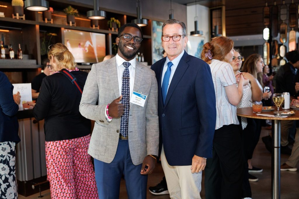 Joseph Inabanza with University of Maine System Chancellor Dannel Malloy.
